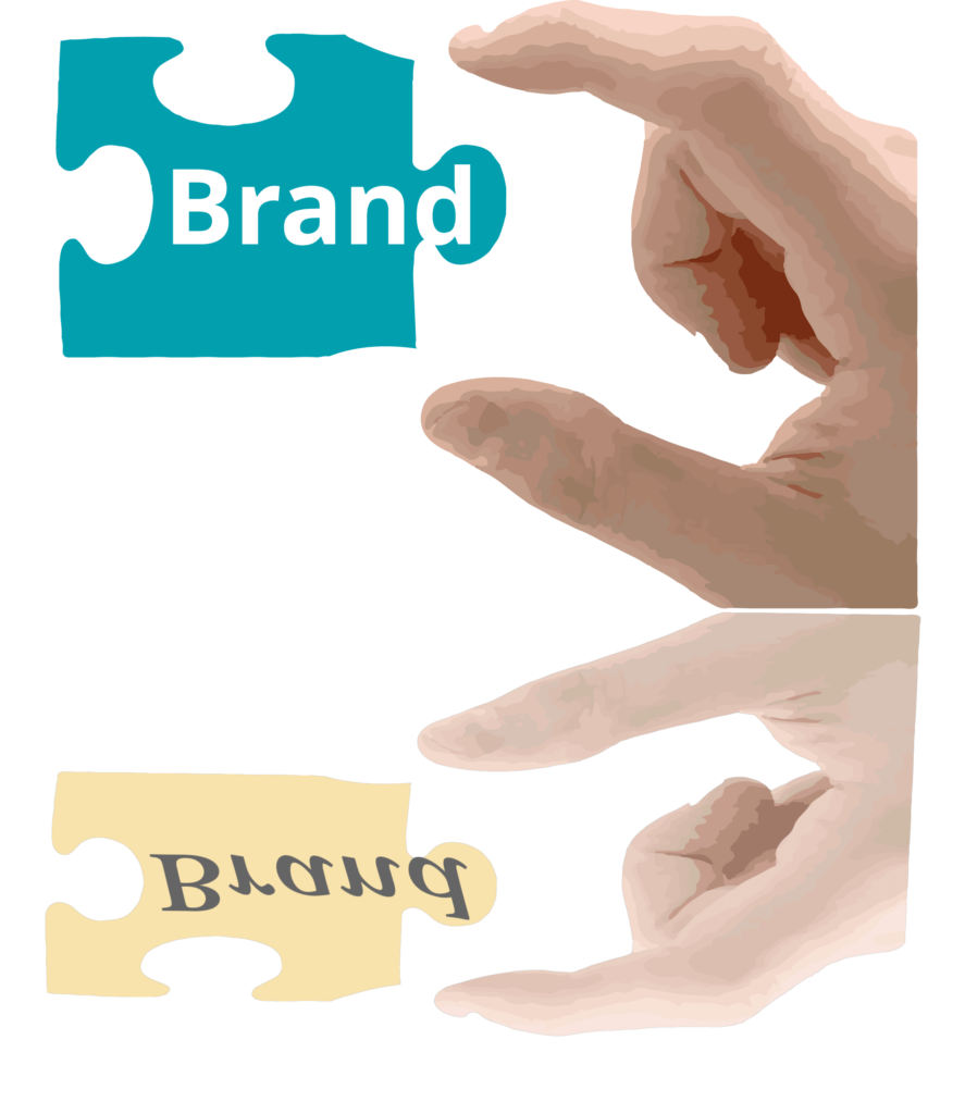 Handing holding puzzle piece and it reflecting differently with the word "Brand" imprinted in the puzzle piece